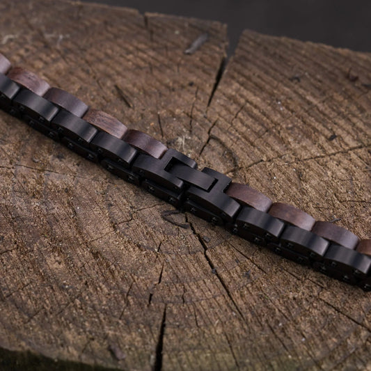 Bracelet with dark brown beads on a wooden surface